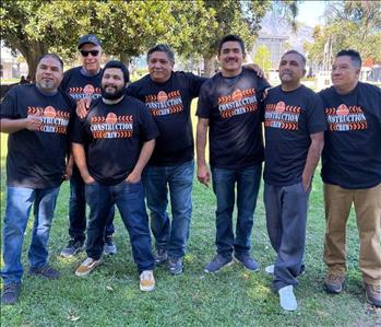 Group of male employees in construction t-shirts